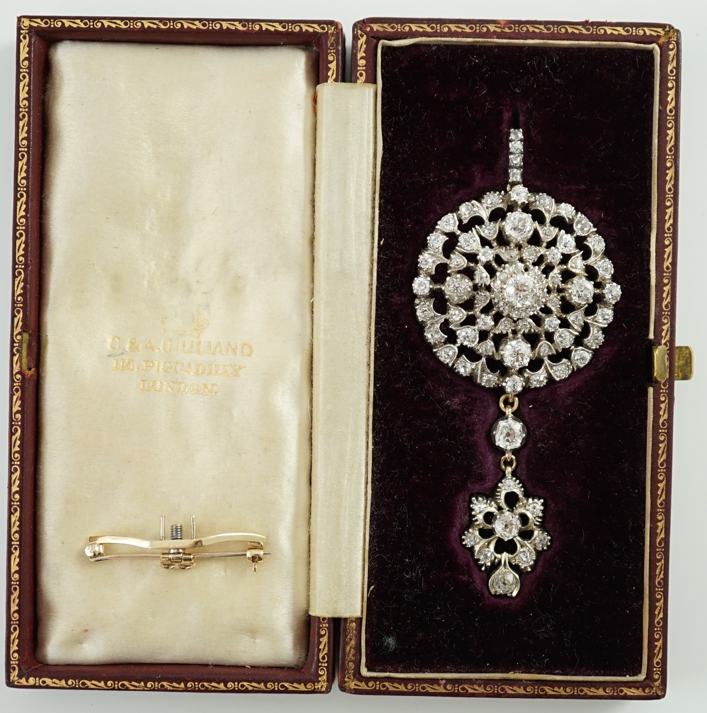 A Victorian gold, silver and graduated diamond cluster set target drop pendant brooch, retailed by Carlo & Arthur Giuliano